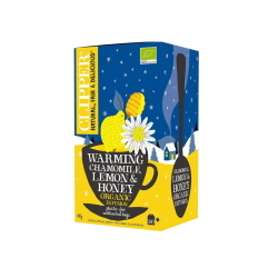 Clipper Warming Chamomile, Lemon & Honey te. En indbydende bl� og gul te�ske illustreret med et hyggeligt snekl�dt vinterlandskab, en varm kop, friske kamilleblomster og en honningske.