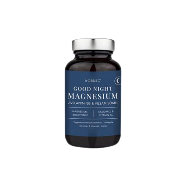 Nordbo Good Night Magnesium. En elegant m�rkebl� glasd�se med s�lvfarvet metall�g, der indeholder 90 veganske kapsler med letoptageligt magnesiumbisglycinat, kamille og B6-vitamin.