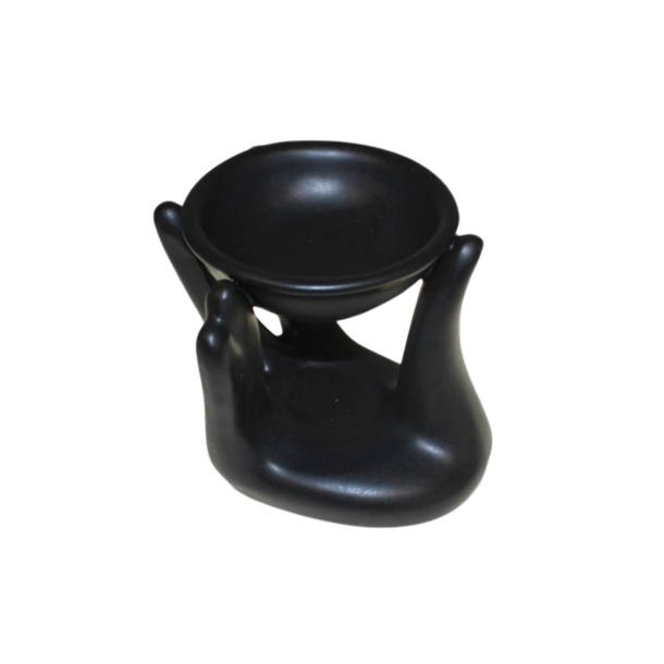 En sofistikeret sort keramisk duftlampe formet som to st�ttende h�nder, der b�rer en lille rund sk�l til fordampning af �teriske olier.
