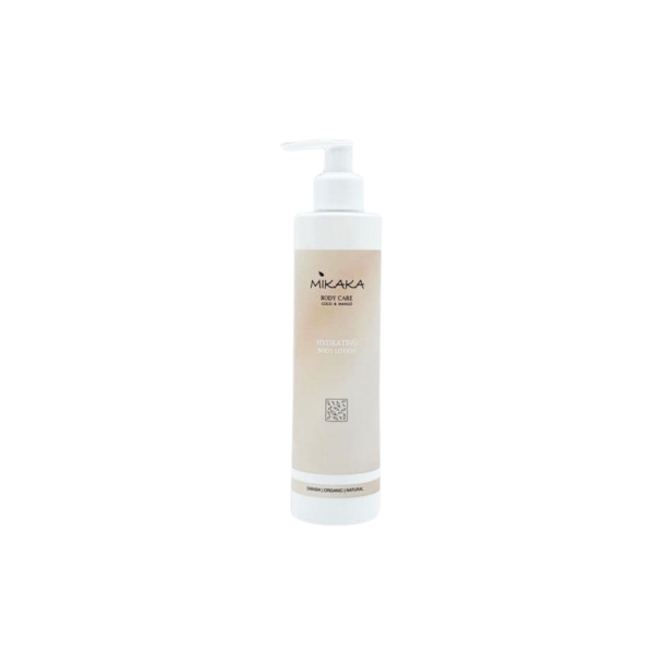 Opretst�ende, hvid Mikaka Body Lotion flaske med pumpe. Den smukke og sarte fersken- og cremefarvede etiket b�rer teksten Coco & Mango samt Mikakas elegante botaniske logo.