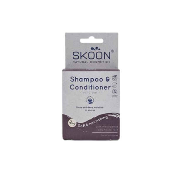 Opretst�ende Skoon Shampoo & Conditioner 2-i-1 solid bar �ske. �sken er gr� og dyb lilla, og teksten fremh�ver indholdet af macadamiaolie og figenekstrakt til alle h�rtyper.