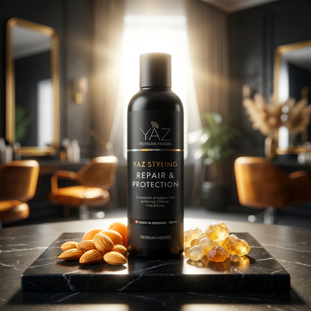 YAZ Persian Herbs h�rstyling pr�senteret p� sort marmor omgivet af gyldne abrikoskerner og akacieharpiks.