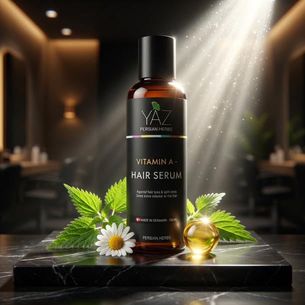 YAZ Persian Herbs h�rserum pr�senteret p� sort marmor omgivet af friske br�nden�ldeblade og gylden risklidolie.